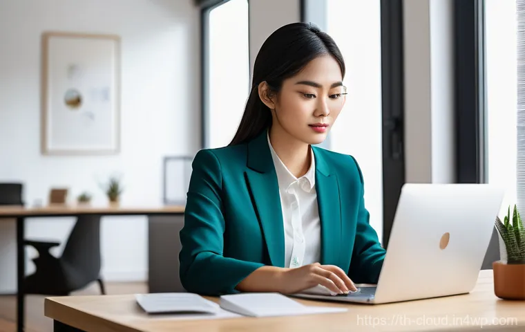 데이터 스토리지 솔루션 비교 - A young, focused professional, possibly a Thai woman in her late 20s, working diligently at a clean,...